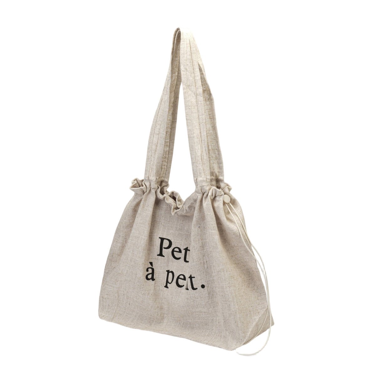 Oversized linnen trekkoord‑shopper “Petit à petit.”